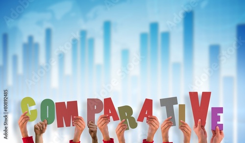 Composite image of hands holding up comparitive