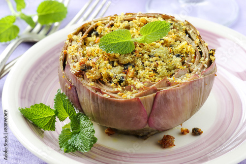 Vegetarian stuffed artichokes decorated with fresh mint