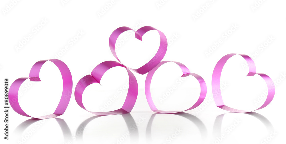Purple hearts from ribbon isolated on white Purple hearts from ribbon isolated on white