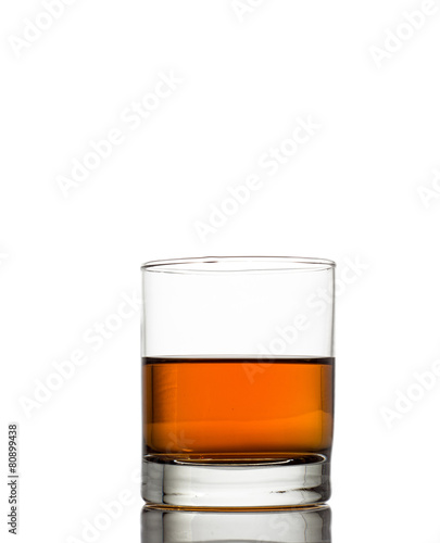 Fotografija Isolated shot of whiskey with splash on white
