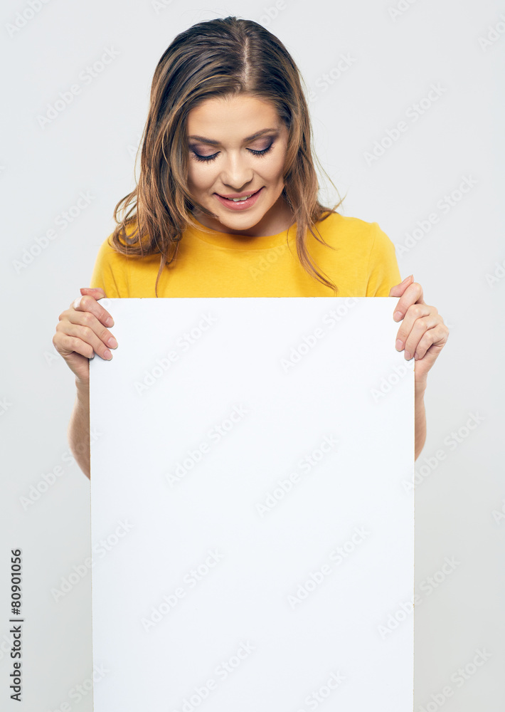 smiling woman looking on blank white card. smiling woman looking on blank white card.