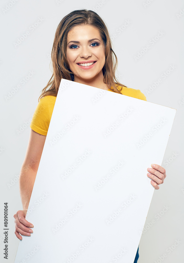 smiling woman holding white sign board. smiling woman holding white sign board.