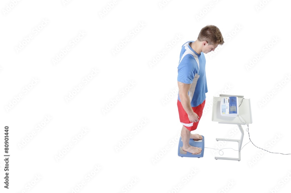 Sportsman doing Weight Assessment with Professional Equipment. M Sportsman doing Weight Assessment with Professional Equipment. M