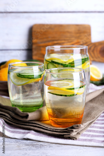 Fresh water with lemon and cucumber in glassware