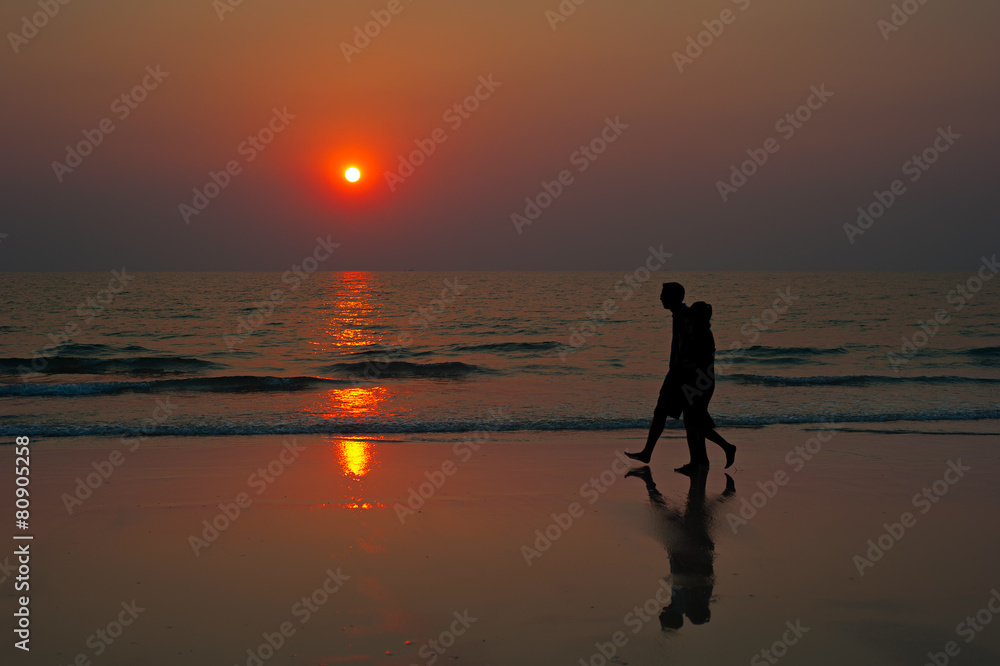 Sunset couple beach