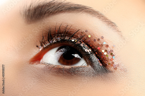 Female eye with fancy glitt...