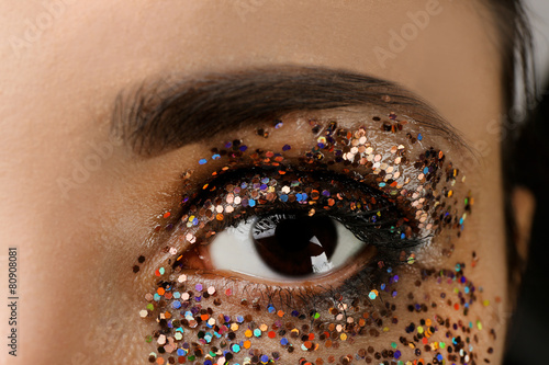 Female eye with fancy glitt...