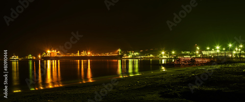 Panorama of sea port Burgas. Ships sand and reflections light.