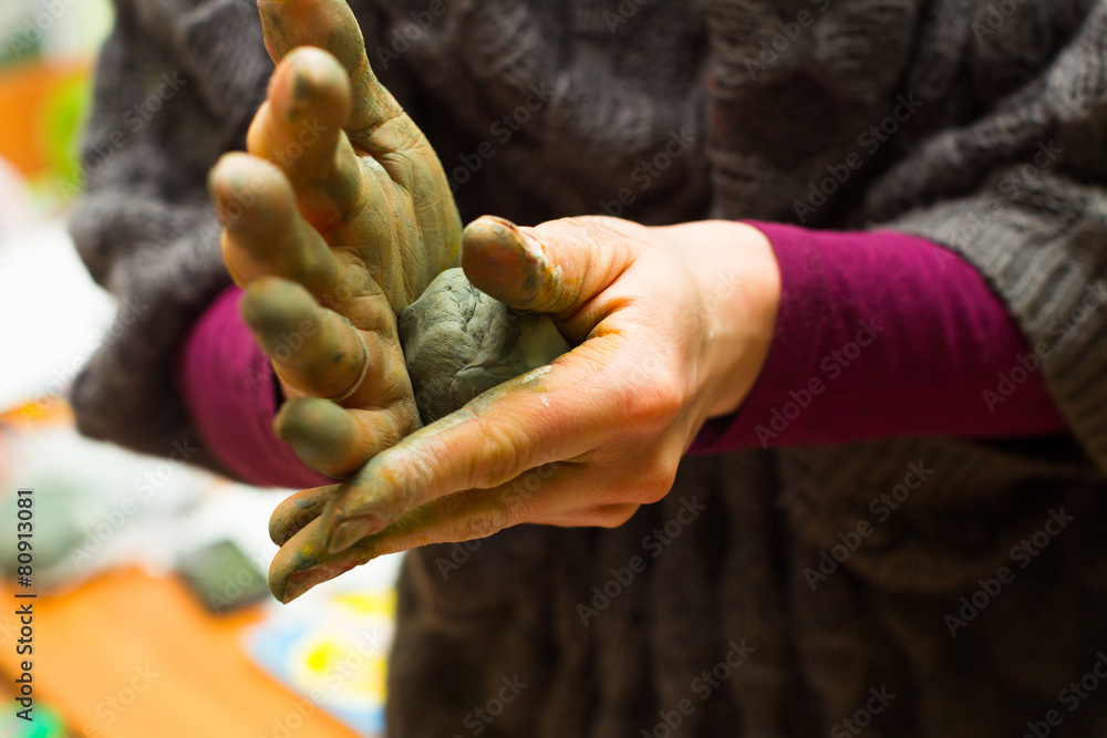 Hands stained with clay and paint. Hands painter and sculptor. C