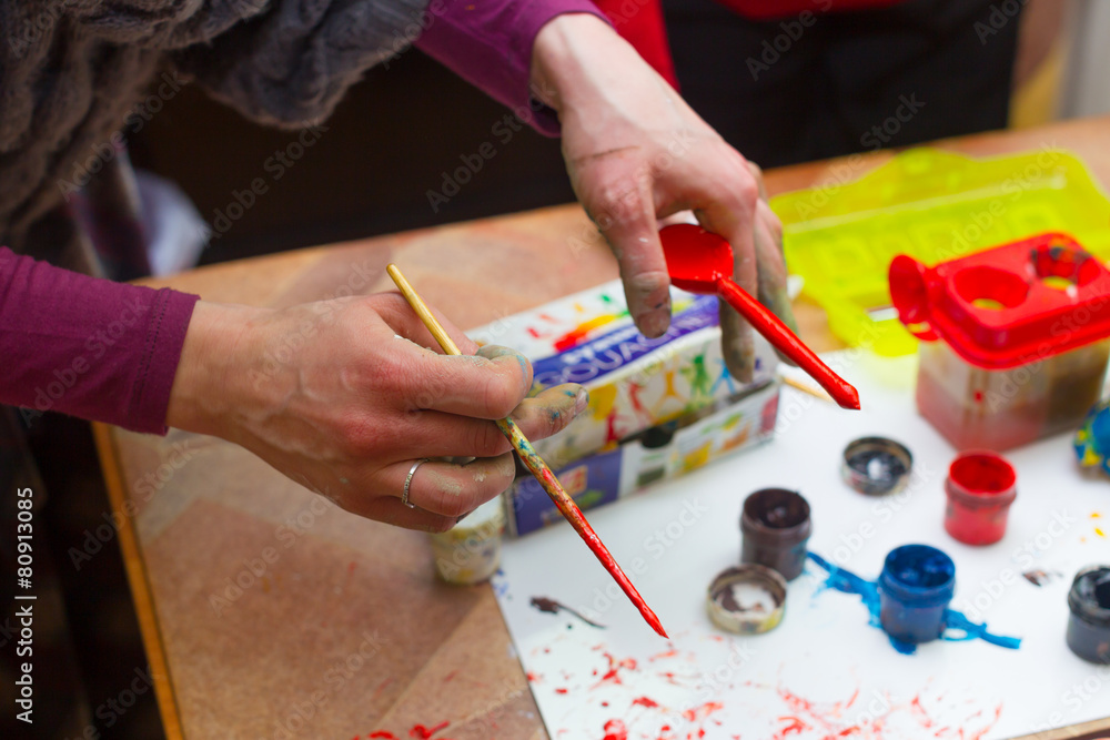Naklejka premium Hands stained with clay and paint. Hands painter and sculptor. C