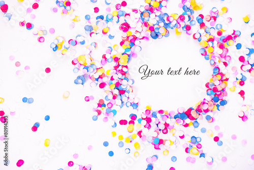 Colorful confetti on white background with sample text