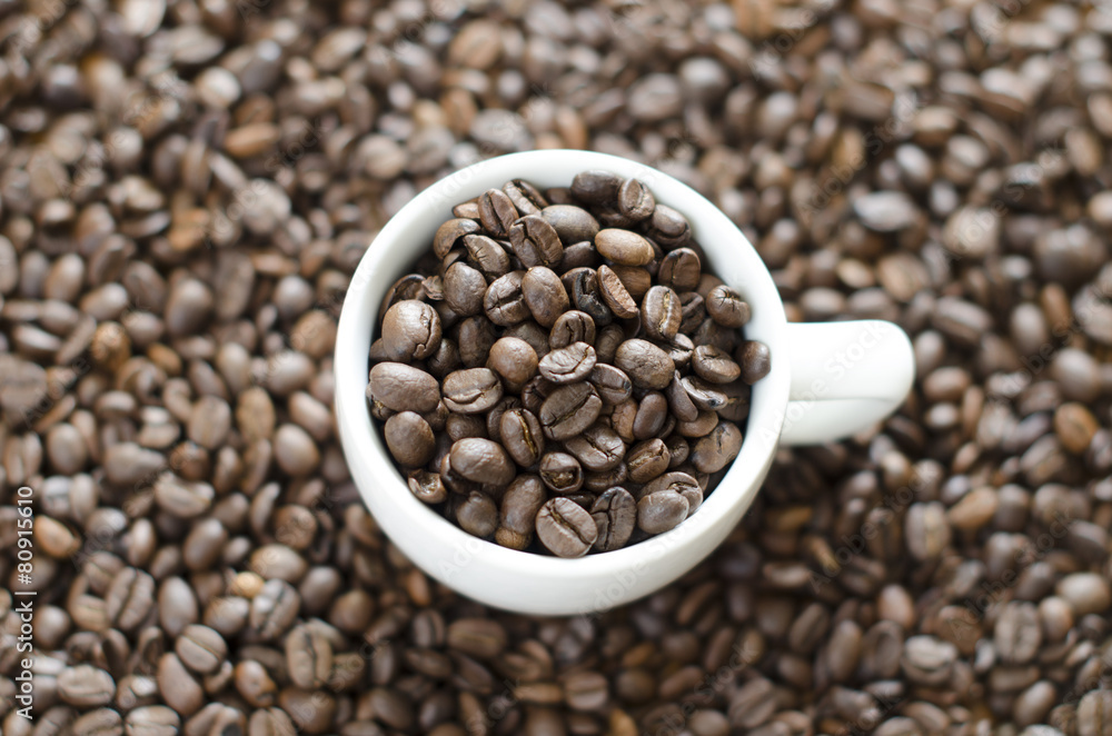 cup of coffee and background from beans cup of coffee and background from beans