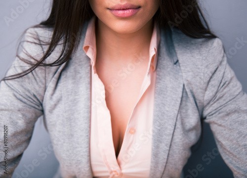 Closeup image of a woman`s decollete with lips photo