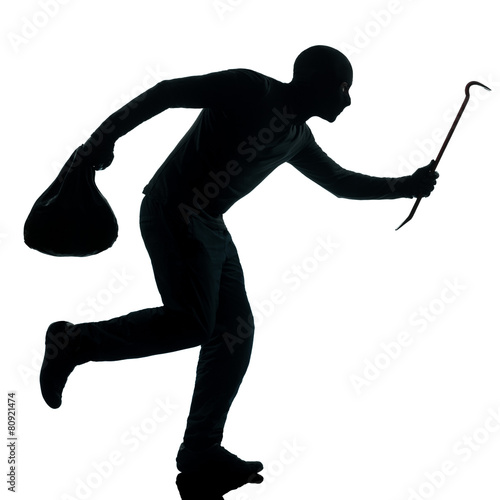man thief criminal running silhouette Fototapet