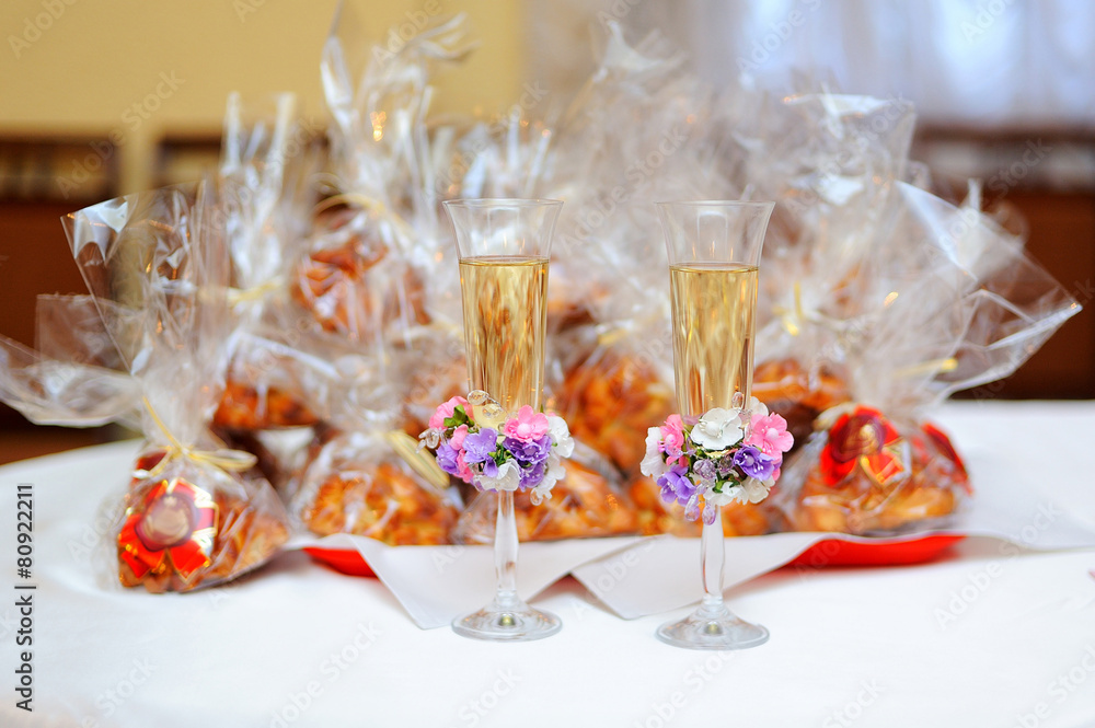 Two glasses with champagne standing on the table Two glasses with champagne standing on the table