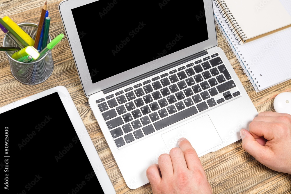 Fototapeta premium Mac. Top view of woman working with laptop in office or at home