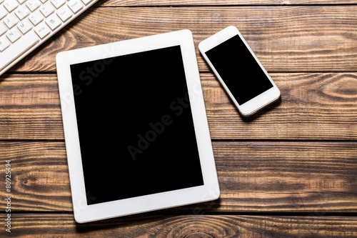 Laptop. Open laptop with digital tablet and white smartphone