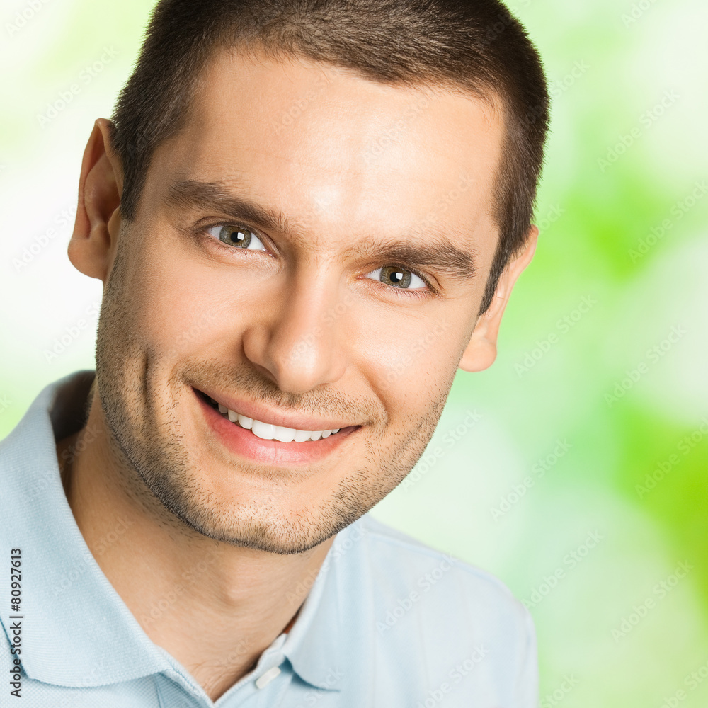 Portrait of young happy smiling man, outdoors Portrait of young happy smiling man, outdoors