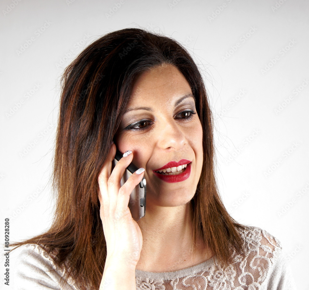 Studio shot of a woman with mobile phone Studio shot of a woman with mobile phone