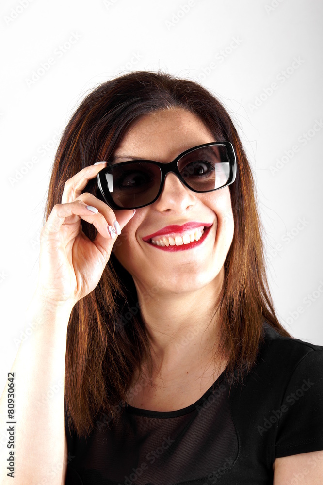 Studio shot of a woman with sunglasses