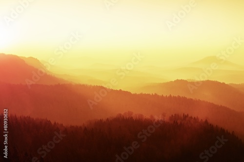 Marvelous daybreak above valley full of colorful mist. © rdonar