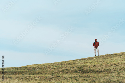 Hiker man standing on the hill
