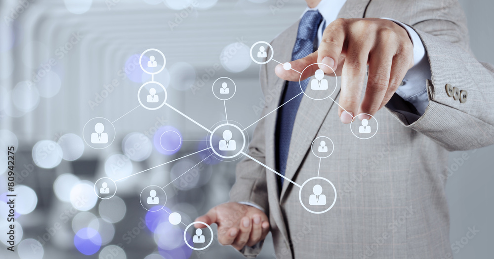 businessman hand showing human icon flow chart on new modern com businessman hand showing human icon flow chart on new modern com