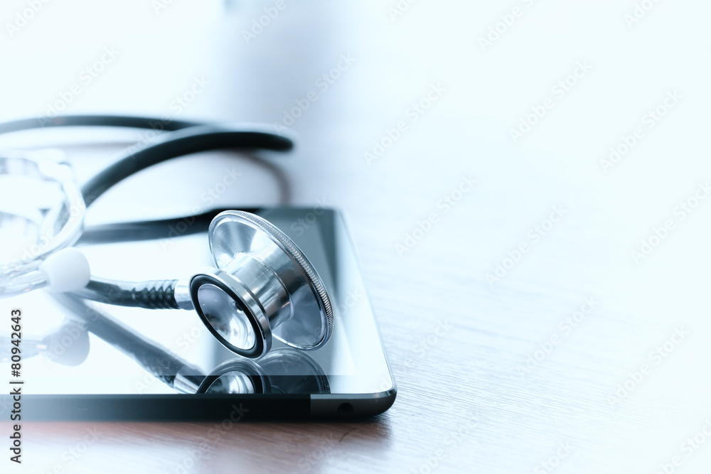 Studio macro of a stethoscope and digital tablet with shallow DO Studio macro of a stethoscope and digital tablet with shallow DO