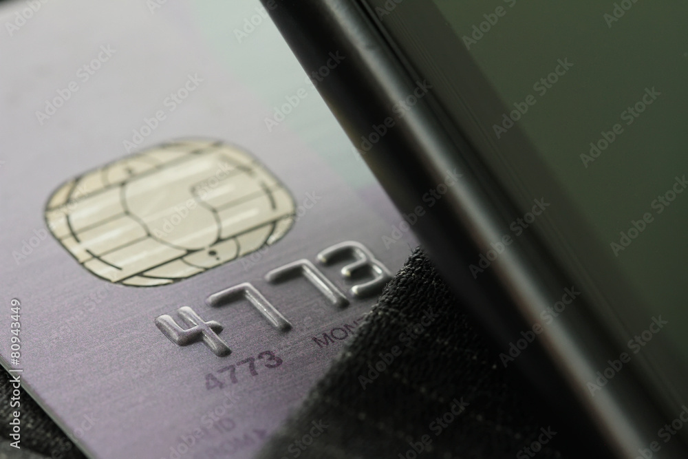 Credit cards in very shallow focus with gray suit background Credit cards in very shallow focus with gray suit background
