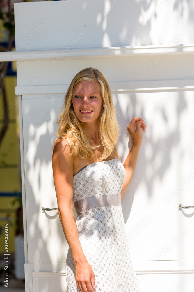 Young blonde woman walking the streets of Zante town Young blonde woman walking the streets of Zante town