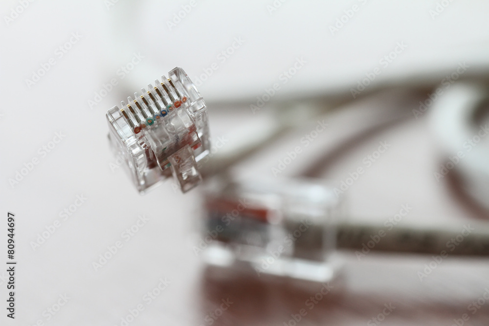 close up of RJ45 Plug Lan Network on wood desk close up of RJ45 Plug Lan Network on wood desk