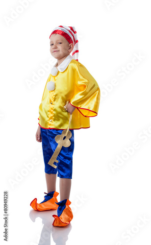 Smug little boy posing in Pinocchio costume