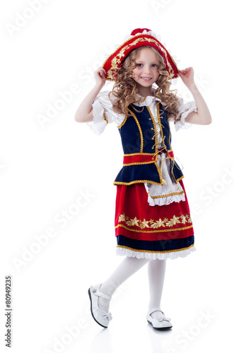 Charming little girl posing in rustic dress