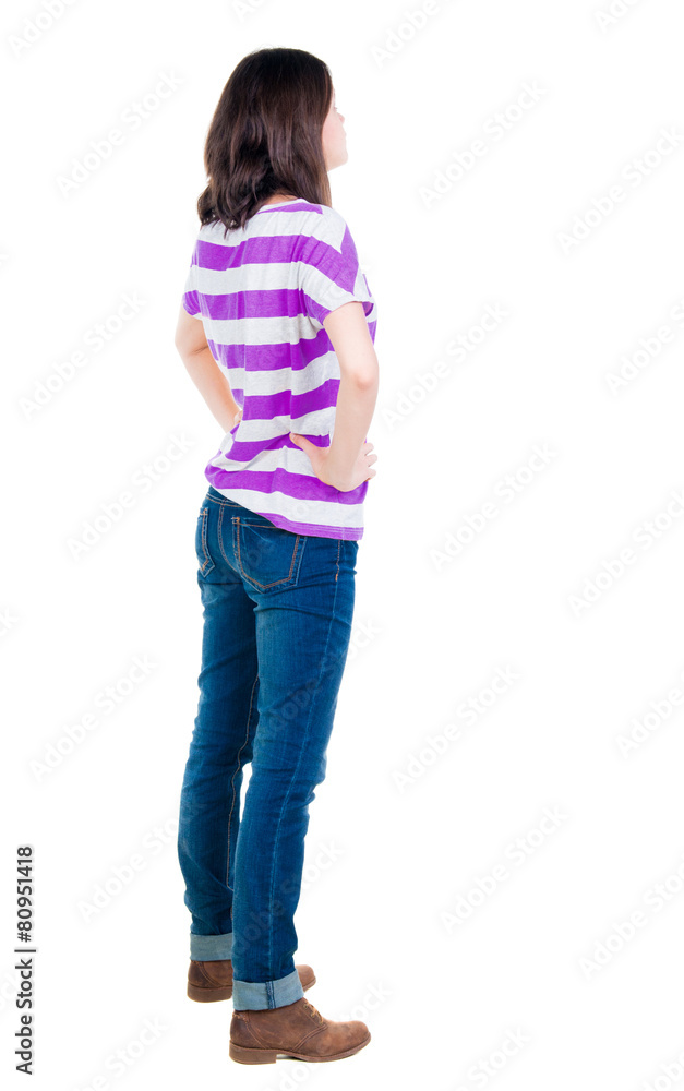 back view of standing young beautiful brunette woman in yellow back view of standing young beautiful brunette woman in yellow