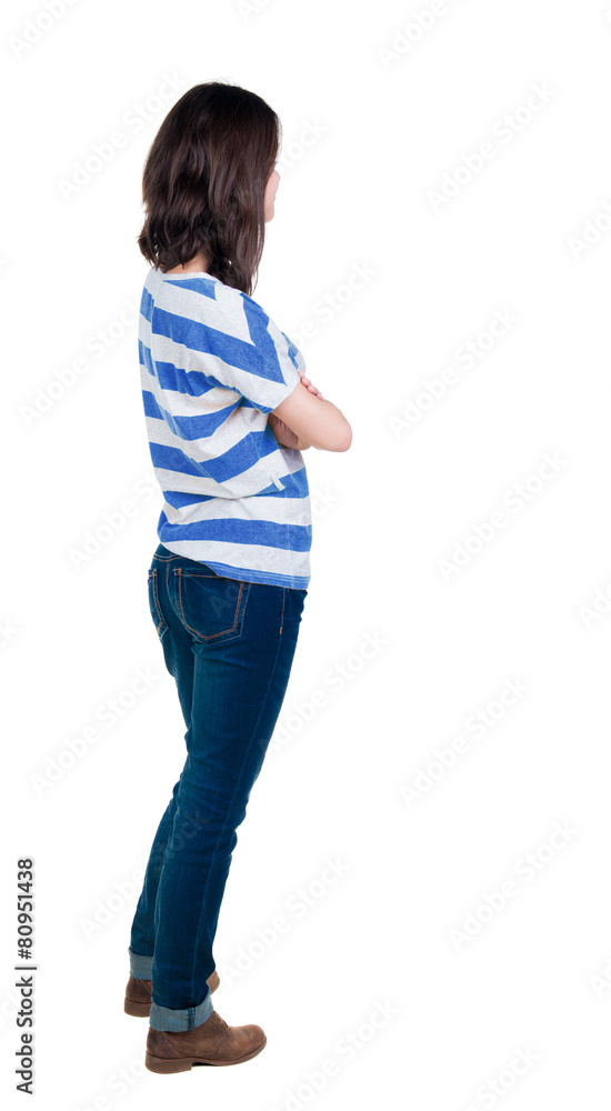 back view of standing young beautiful brunette woman in yellow back view of standing young beautiful brunette woman in yellow