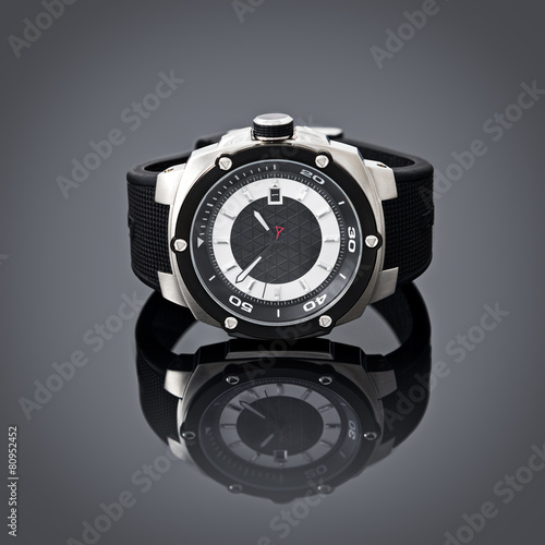Swiss watches on gray vignette background. Product photography.