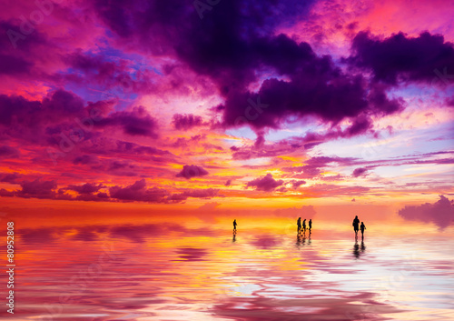 Silhouettes of people at sunset on the beach of Kuta Bali I