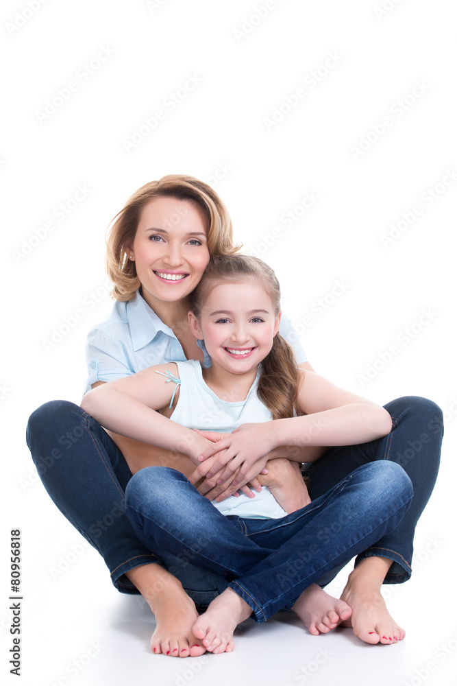 Portrait of smiling mother and young daughter