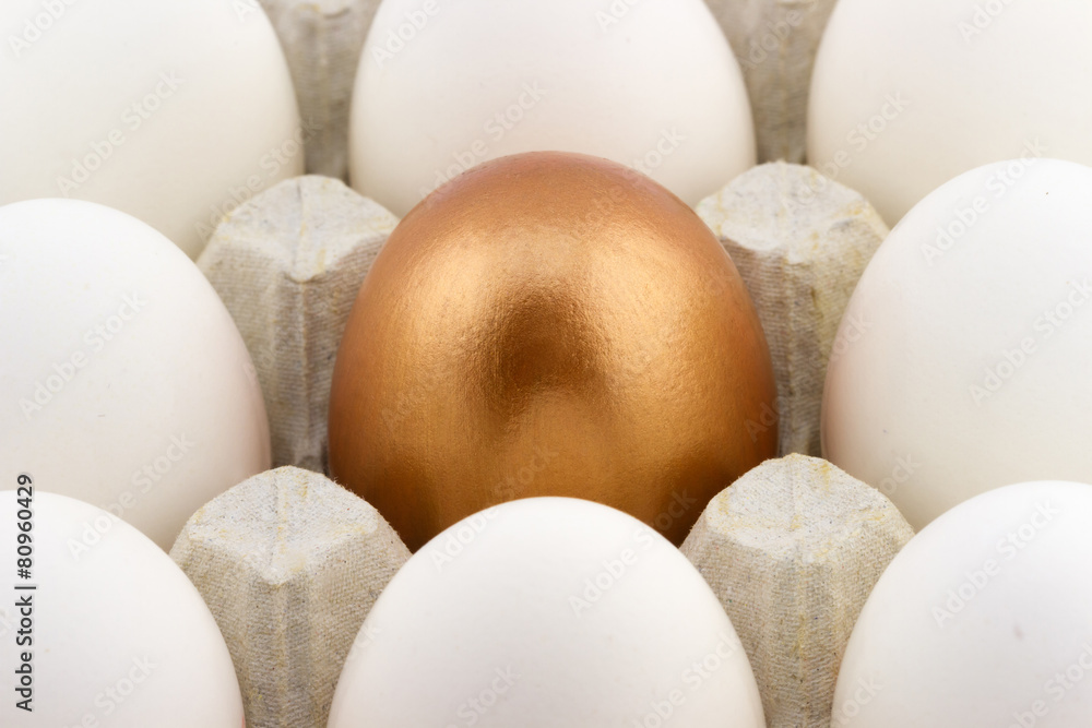 Golden egg arranged in the middle of white eggs Golden egg arranged in the middle of white eggs