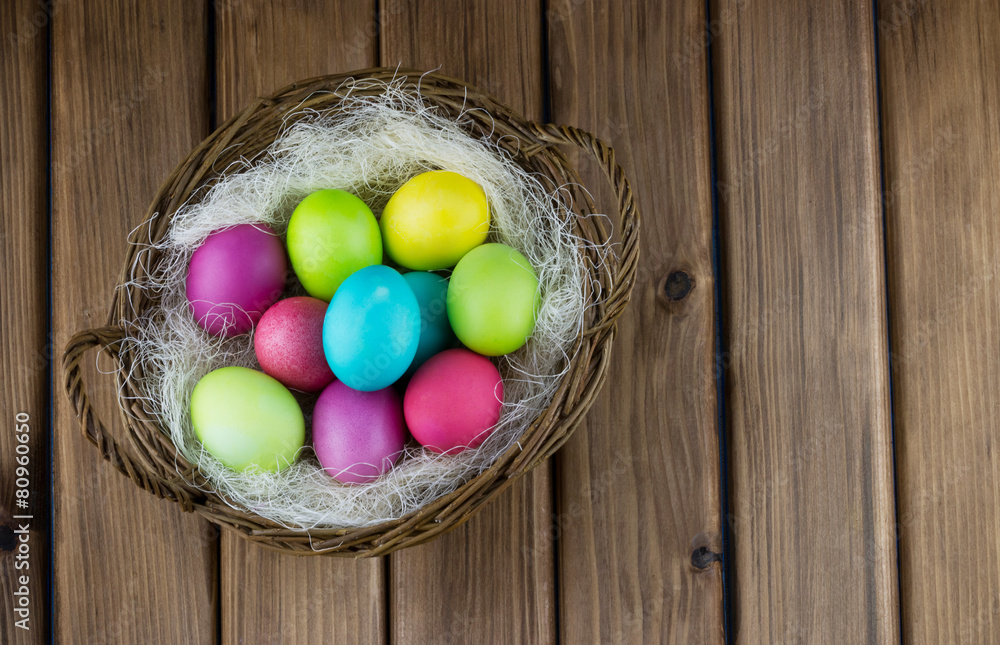 Basket full of colorful painted eggs Basket full of colorful painted eggs