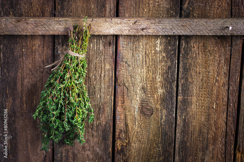 thyme bunch on an old wooden background