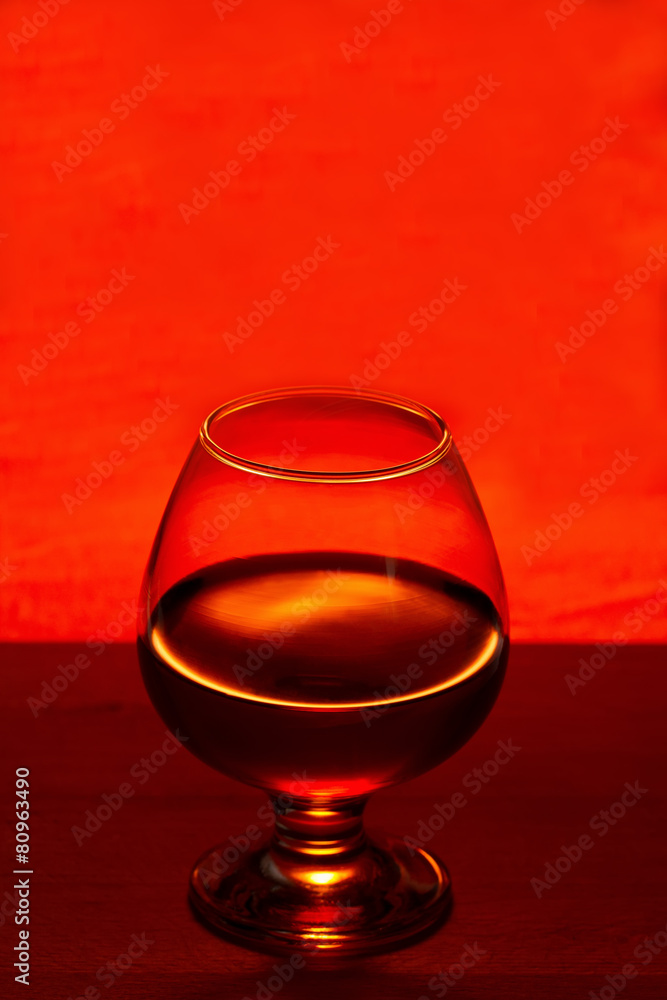 Whiskey or brandy on a wooden table