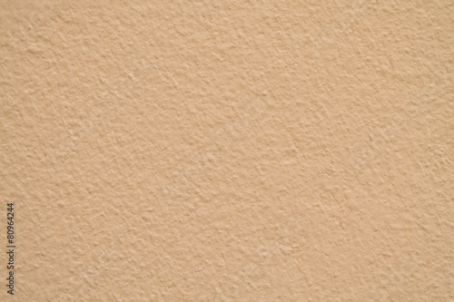 Gold cement wall texture used as background