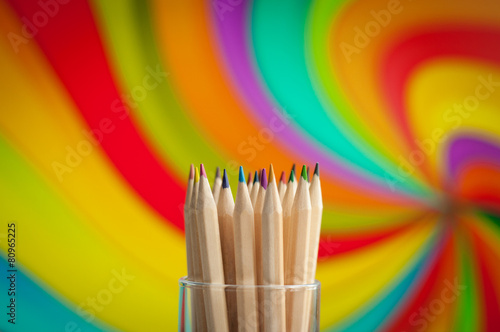 Colorful wooden pencils on colorful background