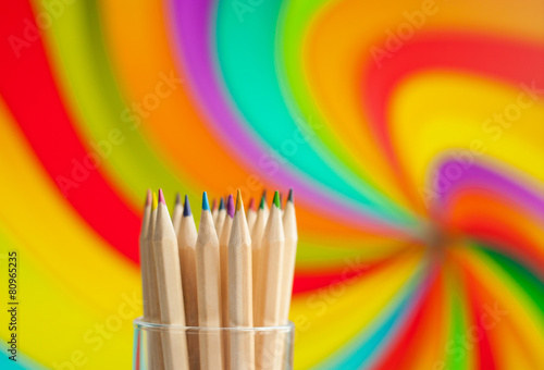 Colorful wooden pencils on colorful background