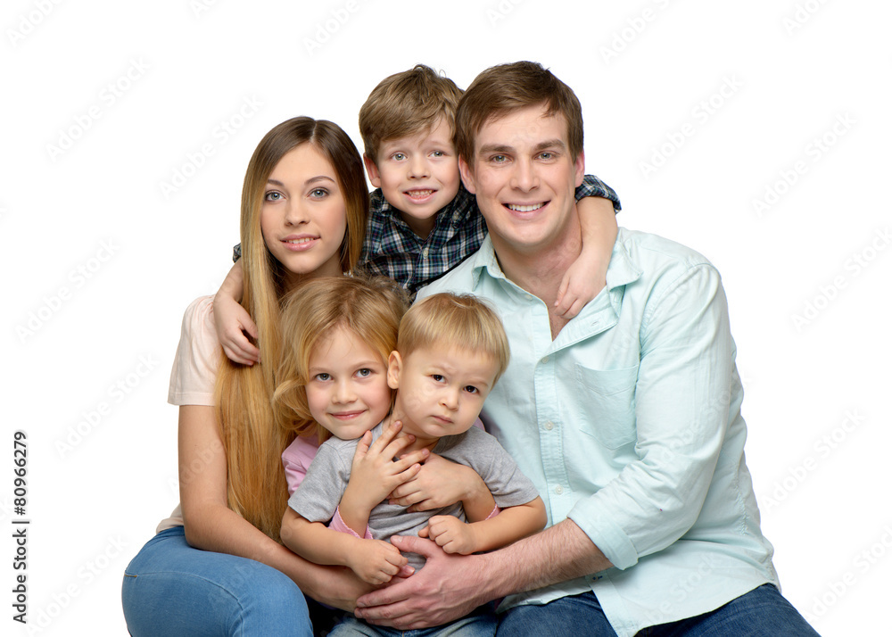 Smiling young family of five enjoying time together