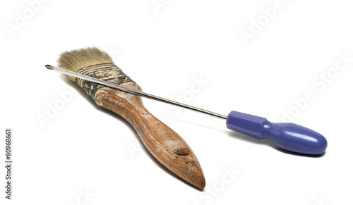 old brush and screwdriver isolated on white background