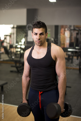 Latin man posing at gym