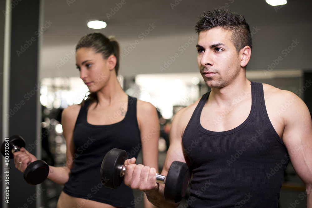 Couple traning at gym Couple traning at gym