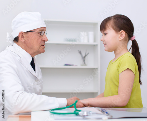 Doctor is examining girl